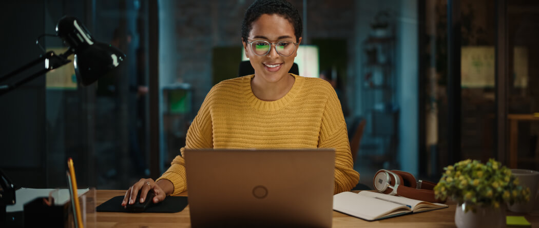 a woman working on her laptop computer