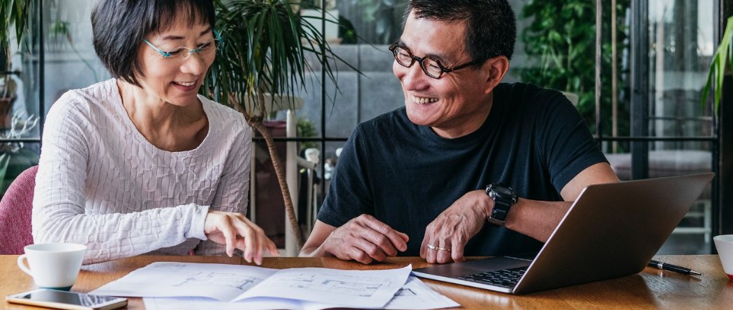 a mature couple reviewing documents