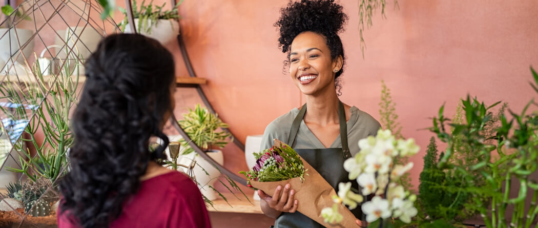 a florist providing flowers to a customer