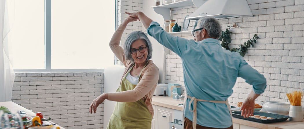 Couple dancing in the kitchen.