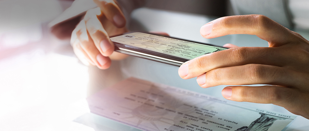 Person scanning and depositing a check using their phone.