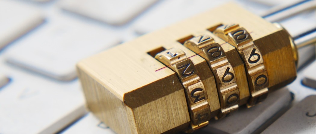 bronze pad lock on a keyboard